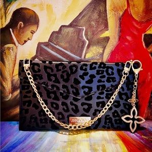 JIMMY CHOO BLK BAG. Cosmetic bag converted into an evening bag.